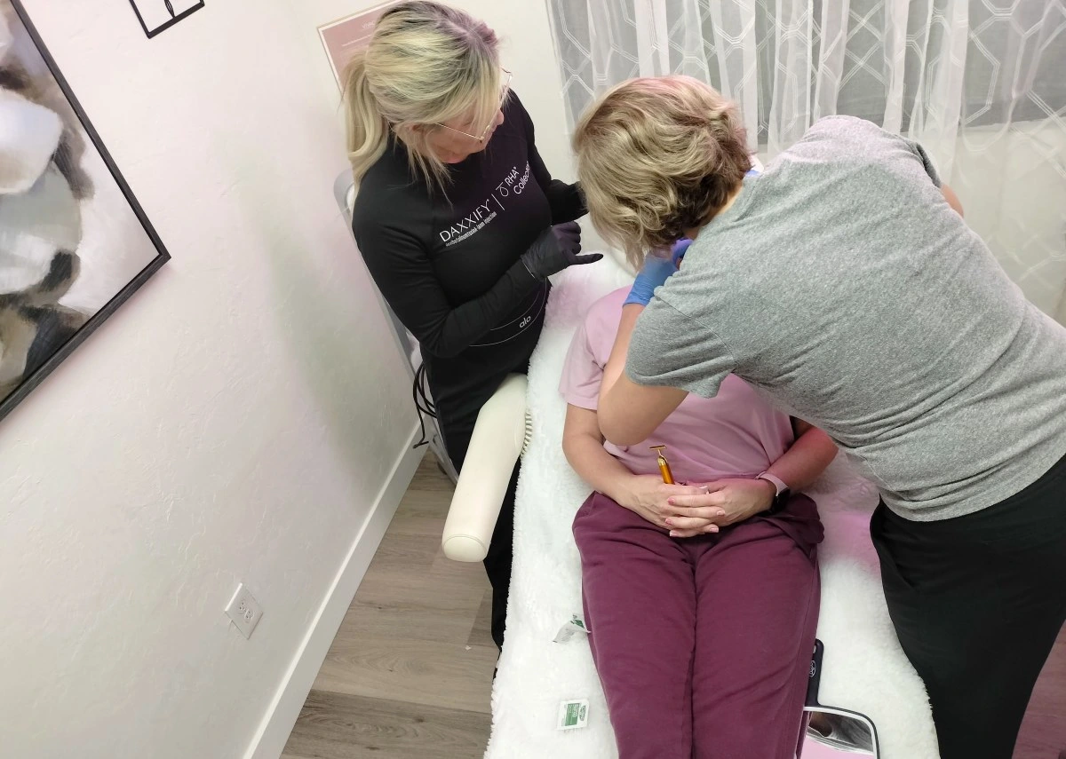 Kelley J. Beck, DNP, FNP-C, Family Nurse Practitioner, consulting with a patient about dermal filler in Tucson, Arizona