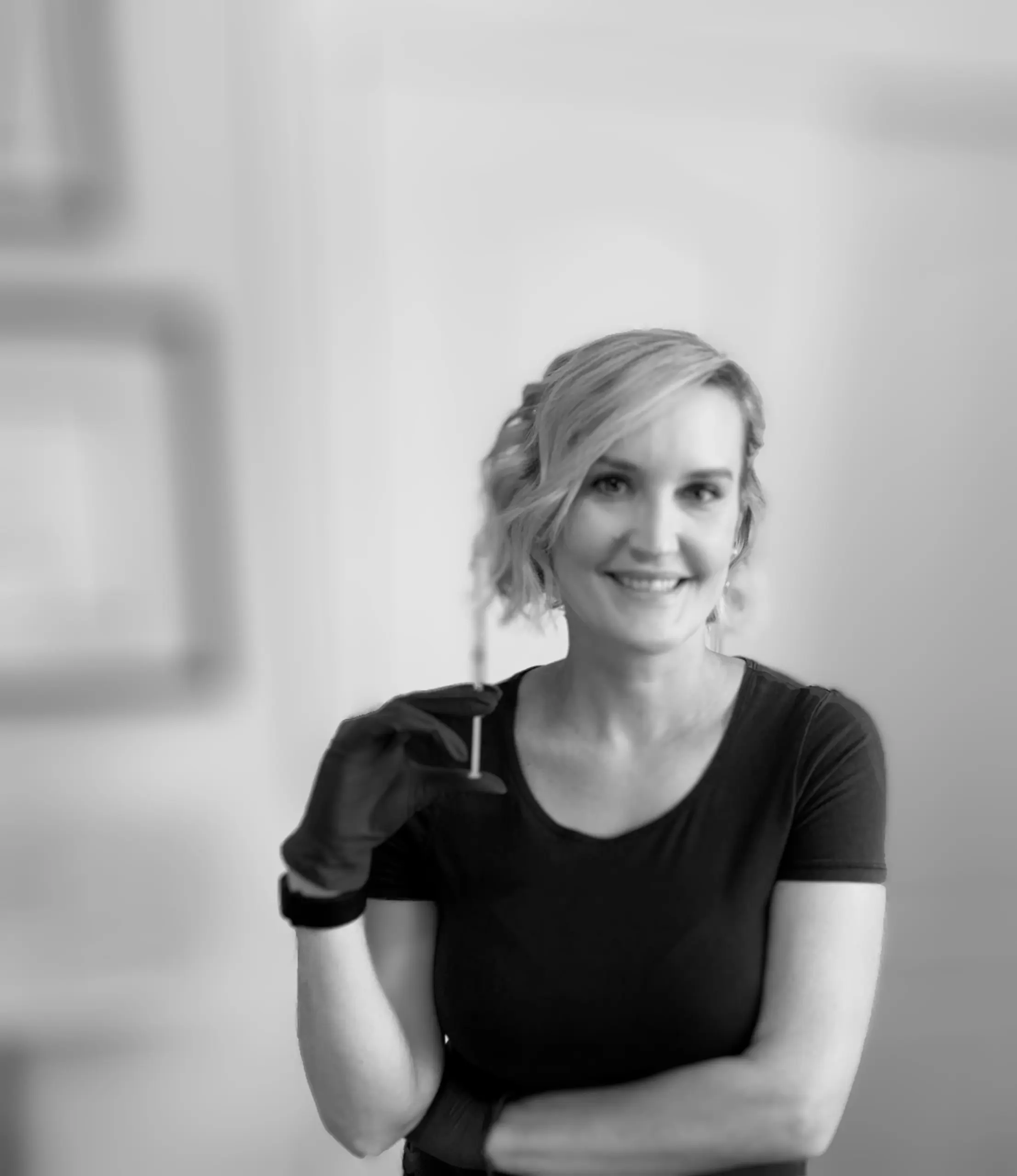 Dr. Kelley J. Beck providing a personalized aesthetic consultation or botox injection treatment in Tucson